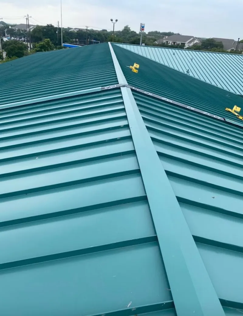 Green commercial metal roof ridge and valley for Metal Roof Repair in San Marcos